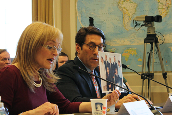 Katrina Lantos Swett, chair of the U.S. Commission on International Religious Freedom, testifies March 15, 2013 on Capitol Hill and holds up a photo of Baha’i leaders who have been sentenced in Iran to 20 years in prison. To her left is Jay Sekulow, chief counsel of the American Center for Law and Justice, who urged the release of Iranian-American minister Saeed Abedini from a Tehran prison. RNS photo by Adelle M. Banks
