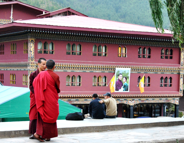 Two monks chatting on the street in Bhutan's national capitol of Thumphu.  RNS photo by Vishal Arora