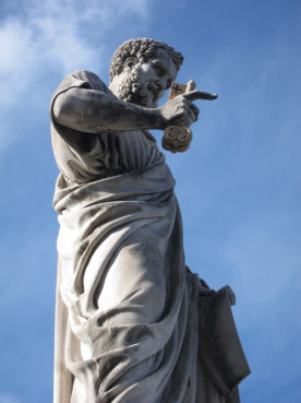 A statue of St. Peter in St. Peter’s Square at the Vatican. The conclave to pick a new pope will begin on Tuesday (March 12) the Vatican said Friday, resolving an open question that had dogged the cardinals meeting here over the past week. RNS photo by David Gibson