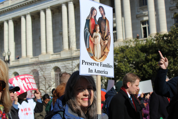 Frances Bouton of Suffolk, Va., joins others in the March for Marriage as they head toward the Supreme Court to oppose same-sex marriage. Throngs of supporters and opponents gathered outside the high court as it considered cases about same-sex marriage. RNS photo by Adelle M. Banks