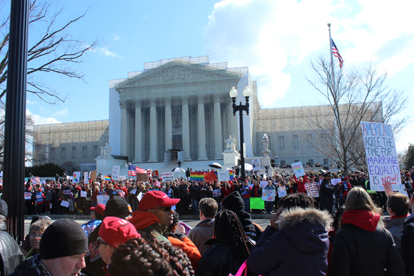 Crowd gathers outside the U.S. Supreme Court on March 26, 2013. Throngs of supporters and opponents gathered outside the high court  this week as it considered cases about same-sex marriage. RNS photo by Adelle M. Banks