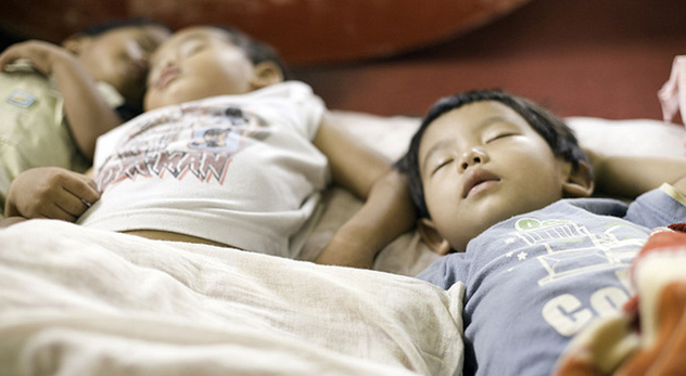 Children sleep in an orphanage in Nepal. Courtesy of Flickr Creative Commons (bit.ly/102eiwp)