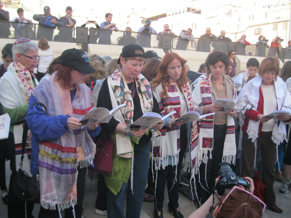 Despite a court decision stating women cannot don prayer shawls at the Western Wall, many members and supporters of Women of the Wall pray with prayer shawls. They want the Israeli government to accommodate the needs of all Jews at the wall, not just those of the ultra-Orthodox. RNS photo by Michele Chabin