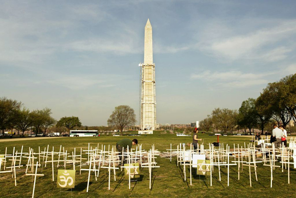 Symbolic grave markers are placed April 11, 2013 on the National Mall in Washington, DC as part of a 24 hour vigil held by religious leaders who will call upon Congress to vote on  legislation to prevent gun violence. Photo by Chris Kleponis/ Lifelines to Healing, PICO National Network/Sojourners