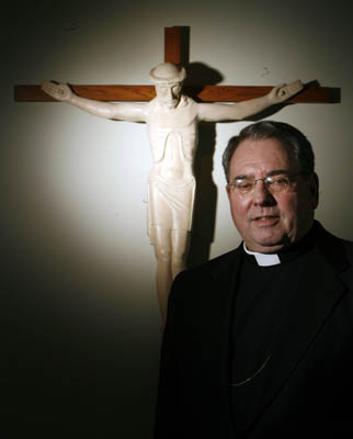 Newark Archbishop John J. Myers is facing fierce criticism for his handling of a priest who attended youth retreats and heard confessions from minors in defiance of a court-ordered lifetime ban on ministry to children. Religion News Service photo by Ed Murray/The Star-Ledger of Newark, N.J.