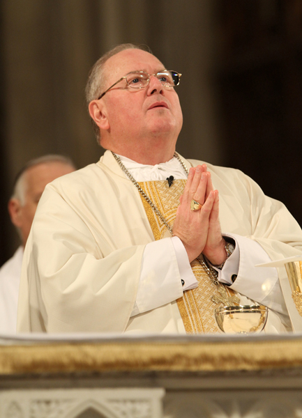 Cardinal Timothy M. Dolan of New York prays during a Mass at St. Patrick's Cathedral in New York May 2, 2013. RNS photo by Gregory A. Shemitz