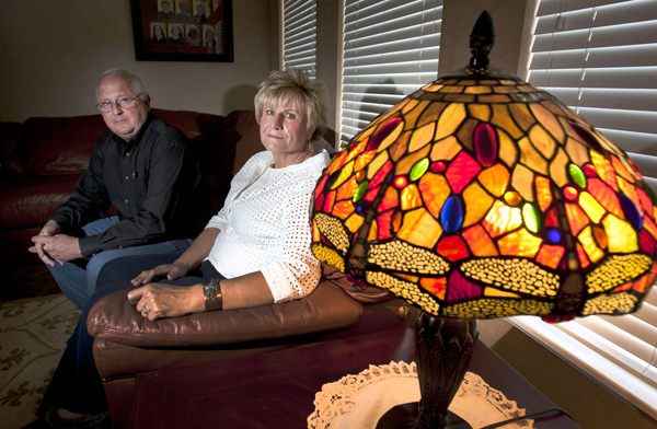 Ken and Lyn McGuire with a dragonfly lamp in their Draper, Utah home Thursday May 2, 2013. The couple is associated with an LDS Church affiliated support group, for people who've lost family members to suicide. They lost  their own son to suicide. Photo by Steve Griffin | The Salt Lake Tribune