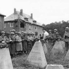 Jewish military chaplain Captain Robert S. Marcus conducts outdoor services at the Siegfried Line in Germany, amid ``dragon's teeth'' ani-tank barriers, on November 3, 1944. Photo courtesy U.S. Army Chaplain Museum, Fort Jackson, South Carolina