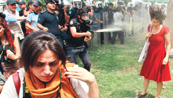 lady in red tear gas in Taksim