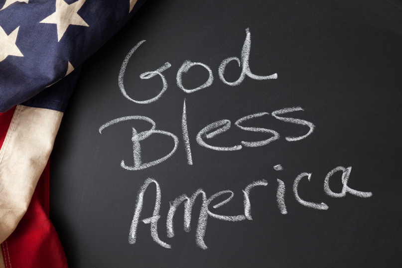 God Bless America sign on a chalkboard with vintage American flag image <a href=