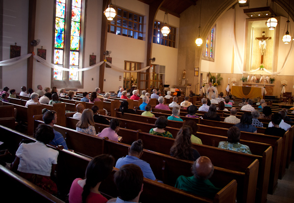 Parishioners listen to the homily during Catholic mass at St. Therese Little Flower parish in Kansas City, Mo. on Sunday, May 20, 2012. RNS photo by Sally Morrow