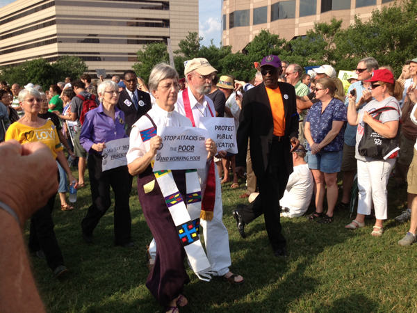 Two clergy members march against cuts to education during the seventh Moral Monday protest on June 17, 2013 in Raleigh, N.C. Photo by Anna Scott/WilmingtonFAVS.com