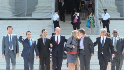 Plaintiffs Sandy Stier and Kristin Perry kiss on Wednesday (June 26) as they leave the Supreme Court with others who argued against California’s Proposition 8, which banned gay marriage.  Two other plaintiffs, Jeff Zarrillo, second left, and Paul Katami, third left, exited with them. Between the couples is attorney David Boies. The high court rejected Prop 8 on legal grounds. RNS photo by Adelle M. Banks