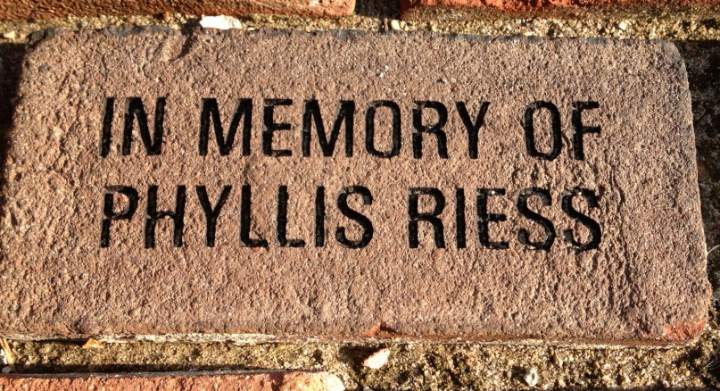 This brick is now in the walkway leading up to our neighborhood library. I think my mom, who loved to read, would be pleased. Today is the six-month anniversary of her death. (Author photo)