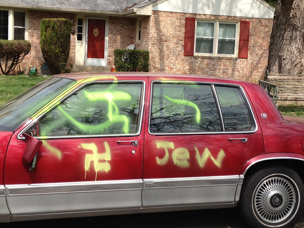 A neighbor reported that a car belonging to an owner two homes down was spray-painted with swastikas and 