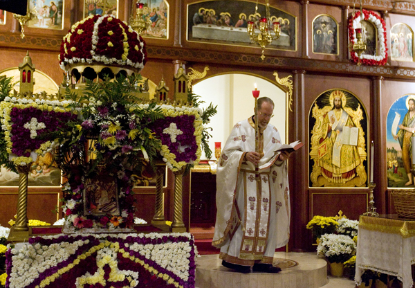 Father Matthew Gilbert leads the Agape Vespers service, which culminates the end of Holy Week festivities for the Orthodox Christian faith, at the Holy Trinity Cathedral in Salt Lake City on May 5, 2013. He is carrying a candle the symbolizes the light of Christ and is standing next to (left) a structure that symbolizes the tomb of Christ. Photo by Kim Raff  |  The Salt Lake Tribune