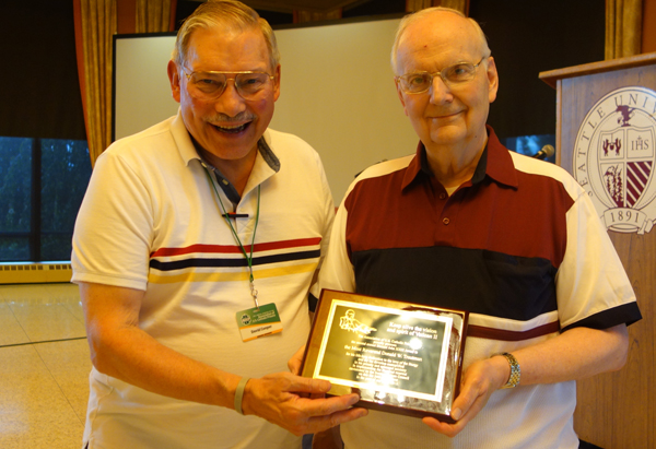 (Left) Fr. Dave Cooper, Milwaukee  - AUSCP, Board Chair presents the Blessed John XXIII Award to Bishop Donald W. Trautman (right), Diocese of Erie, PA., for his dedication to the love of the liturgy and for his devotion to priestly and episcopal ministry in the liturgical renewal envisioned by the Second Vatican Council. Photo courtesy Association of US Catholic Priests (AUSCP)