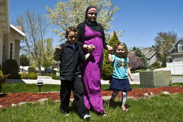 Sharifa Al-Qaaydeh and her kids Sajed, 5, and Summer, 3, walk around their home Wednesday May 4, 2011. Photo by Chris Detrick | The Salt Lake Tribune
