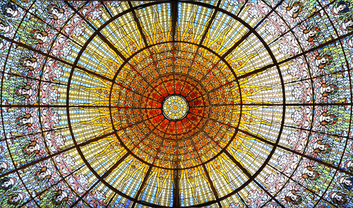Palau de la Musica Catalana skylight of stained glass designed by Antoni Rigalt whose centerpiece is an inverted dome in shades of gold, on June 2, 2012 in Barcelona