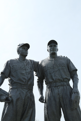 Statue of Pee Wee Reese putting his arm around Jackie Robinson, depicting the moment in 1947 when Reese signaled to a hostile crowd that Robinson, the first black player in major league baseball, was one of the team. The statue, outside a Coney Island minor league field, was defaced this week with a swastika and racial and anti-Semitic slurs.