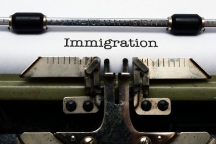 A typewritten sheet of paper with the word "immigration"