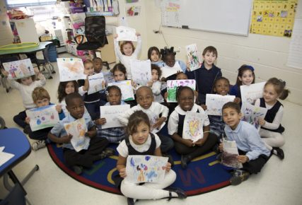 Kids show their artwork in classroom at the Hebrew Language Academy in Brooklyn, a public charter school founded in 2009 with the help of the Hebrew Charter School Center. Photo courtesy of the Hebrew Charter School Center