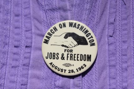 An attendee wears a button from the 1963 march at the National Action to Realize the Dream march on Aug. 24, 2013 commemorating the 50th anniversary of the 1963 March on Washington. Photo by Adelle M. Banks