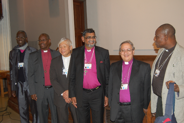 Among others, (center) Archbishop Ian Ernest, of the Province of the Indian Ocean, with (second from right) Archbishop Mouneer Anis, of Egypt, and (far right) Bishop Josiah Iduwo-Fearon of Nigeria, at the conclusion of the Anglican Back to the Future Conference in Toronto, Canada, on Wednesday (Sept. 18). RNS photo by Bob Bettson