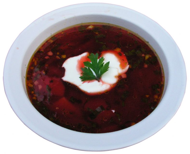 A bowl of borscht -- a soup made of beets, and often topped with sour cream -- popular among immigrant American Jews. Image courtesy of Nillerdk via Wikimedia Commons.