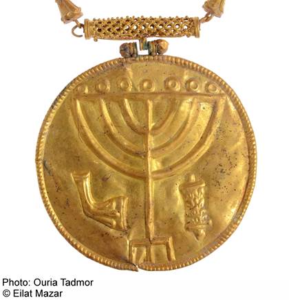 A cache of gold coins, jewelry and what is believed to be a Torah scroll decoration were discovered at the foot of the Temple Mount. Photo courtesy the Hebrew University