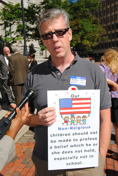 Andrew Hall, an atheist and father, demonstrates Wednesday outside the Massachusetts Supreme Judicial Court. He says recitation of the pledge of allegiance in schools should be deemed unconstitutional in Massachusetts. Photo by G. Jeffrey MacDonald