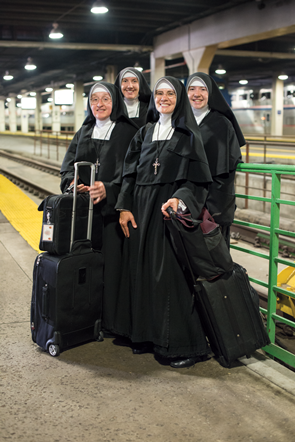 Sister Mary Xavier Selway, Sister Mary Raphael, Sister Mary Jognes and Sister Antoinette Marie pose for an iconic Amtrak ad.