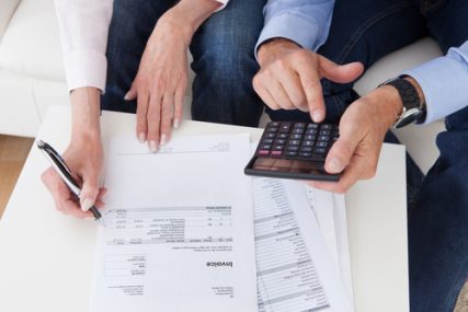 Close-up of couple dealing with finances