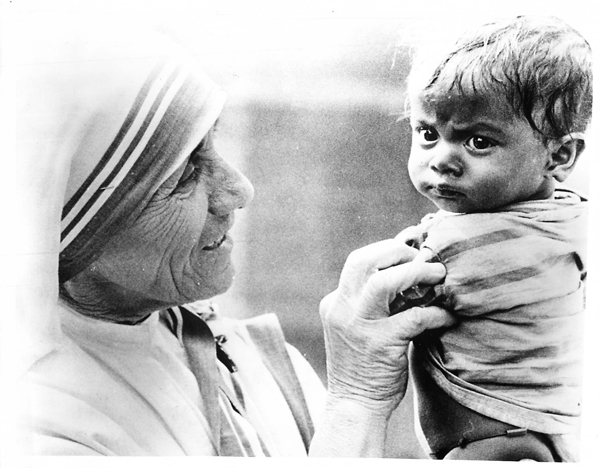 Mother Teresa of Calcutta, shown with an Indian child in 1977, worked to help sick and homeless victims in the cyclone-ravaged Indian state of Andhra Pradesh. She said her Missionaries of Charity nuns have 