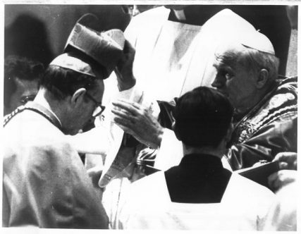 (1983) Pope John Paul II places a red biretta on the head of Archbishop Joseph L. Bernardin of Chicago as he was elevated to cardinal during a Feb. 2 consistory at the Vatican. Cardinal Bernardin was one of 18 new cardinals invested at the service. Religion News Service file photo