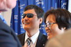 (RNS) Chinese activist Chen Guangcheng and his wife, Yuan Weijung, laugh before a Wednesday (Oct. 2) press conference announcing Chen's affiliations with three American organizations. RNS photo by Katherine Burgess.