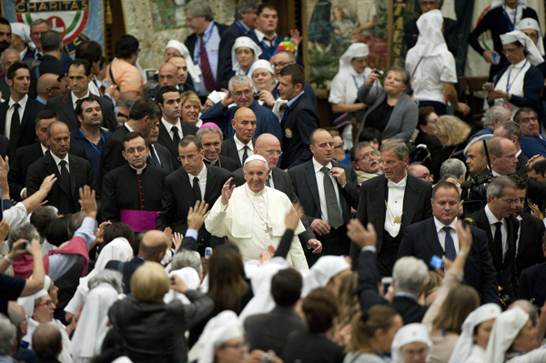 Pope Francis greets people during a meeting with UNITALSI, an Italian Catholic association for the transportation of sick people to Lourdes and other Marian shrines, in Paul VI hall at the Vatican on Saturday (Nov. 9). Photo by Alessia Giuliani, courtesy Catholic News Service