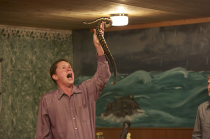 Ahhhhh! Andrew Hamblin preaches while holding a snake above his head in LaFollette, Tenn. Photo courtesy National Geographic Channels