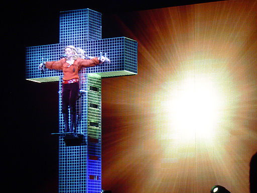 Madonna in her Confessions Tour, hanging from a mirrored cross in 2006.