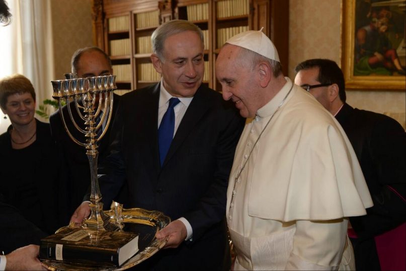 Israeli Prime Minister Benjamin Netanyahu exchanges gifts with Pope Francis at the Vatican Monday morning. 