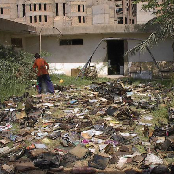 Workers attempted to dry the books and documents found in Iraq in 2003 by placing them outdoors. Photo courtesy of Harold Rhode via US National Archives and Records Administration