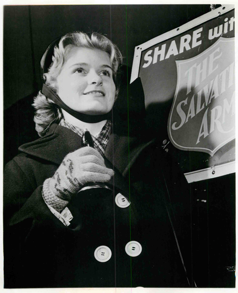 (Date unknown) A Salvation Army worker with a collection bell solicits funds on a street corner during the Christmas season. Religion News Service file photo