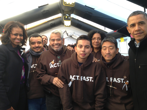 President Obama and First Lady Michelle Obama pose for a photo with fasters for immigration reform.  Photo courtesy Fast4Families