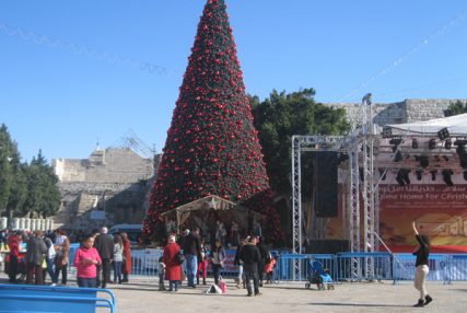 Tens of thousands of pilgrims descended on Bethlehem in the days leading up to Christmas. Despite ongoing repairs to the Church of the Nativity, pilgrims have been able to access the church, built atop the traditional site of Jesus's birth. In Manger Square (pictured here), adjoining the church, the Palestinian Authority erected a large Christmas tree, nativity scene and Christmas decorations. RNS photo by Michele Chabin