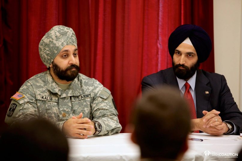 On January 8, 2014, Major Kamaljeet Singh Kalsi, left, with Amandeep Singh Sidhu from the law firm McDermott Will & Emery delivered a policy briefing to Congressional staff on barriers to religious liberty for Sikh Americans who wish to serve in the U.S. Armed Forces at Capitol Hill in Washington, D.C. Photo courtesy of © The Sikh Coalition | Photo by Susan Biddle.