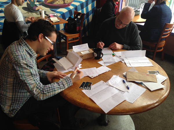 Volunteers Bill Boulden, left, and Jim Oliver, write letters to prisoners at the first meeting of the Freethought Books Project Correspondence Club in Buffalo, NY. Photo courtesy of Sarah Kaiser, Center for Inquiry