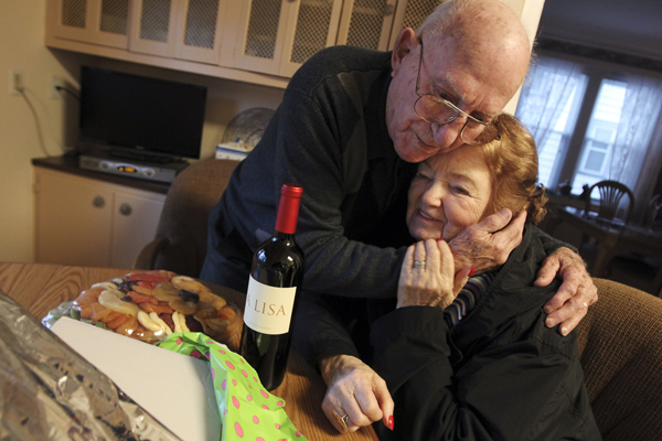 Joe Barbella, 93, of Union, and Marsha Kreuzman, 90, embrace for awhile after she brought him a Christmas present to his house on Dec. 23, 2013.  Kreuzman survived five concentration camps during WWII. After moving to New Jersey, she started looking for soldiers who liberated Mathausen, the last camp she resided in. In November she located Joe Barbella, 93, who was one of the soldiers in the division that liberated the camp. The two met up later that month. Kreuzman stopped by Barbella's home to give him a Christmas present. Photo by Saed Hindash/The Star-Ledger