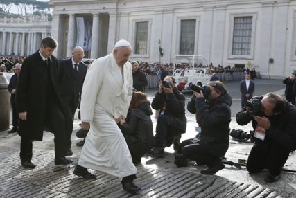 Pope Francis passes news photographers as he arrives to lead his general audience in St. Peter's Square at the Vatican on Wednesday (Jan. 15). Photo by Paul Haring, courtesy of Catholic News Service
