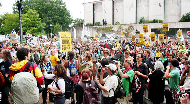 A protest during Appalachia Rising's day of action in September of 2010. Yellow signs in the crowd read, 