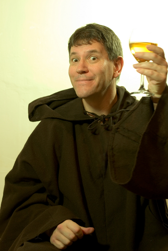 A monk enjoying some vino. Vatican City consumes more wine per capita than any country in the world, a new study proves. (Who thinks of such a study?) Image courtesy of Robert Brown Stock via Shutterstock
